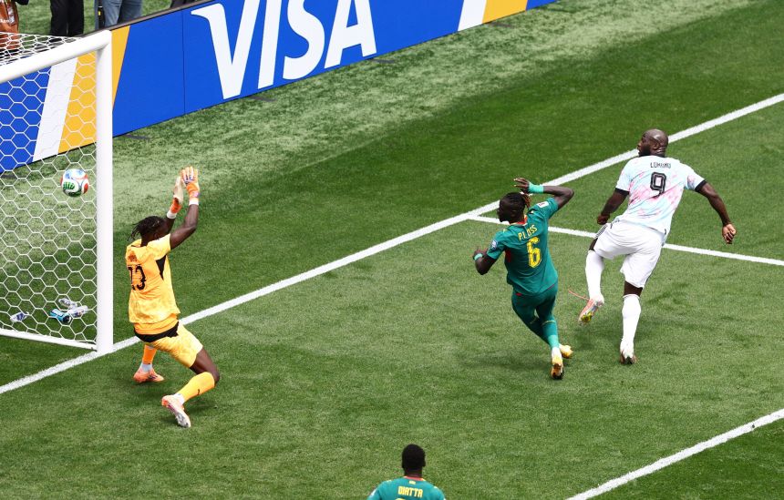 Belgium's Romelu Lukaku scores their first goal past Senegal's Mory Diaw.